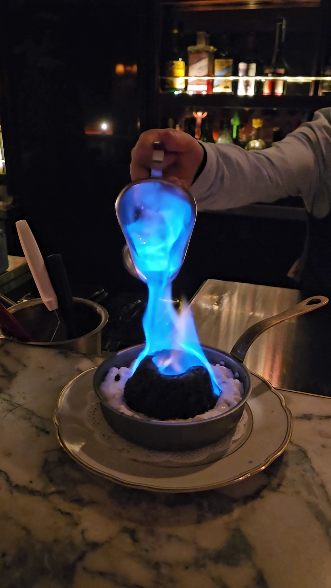 Tableside flame and cocktail theatre at the bar