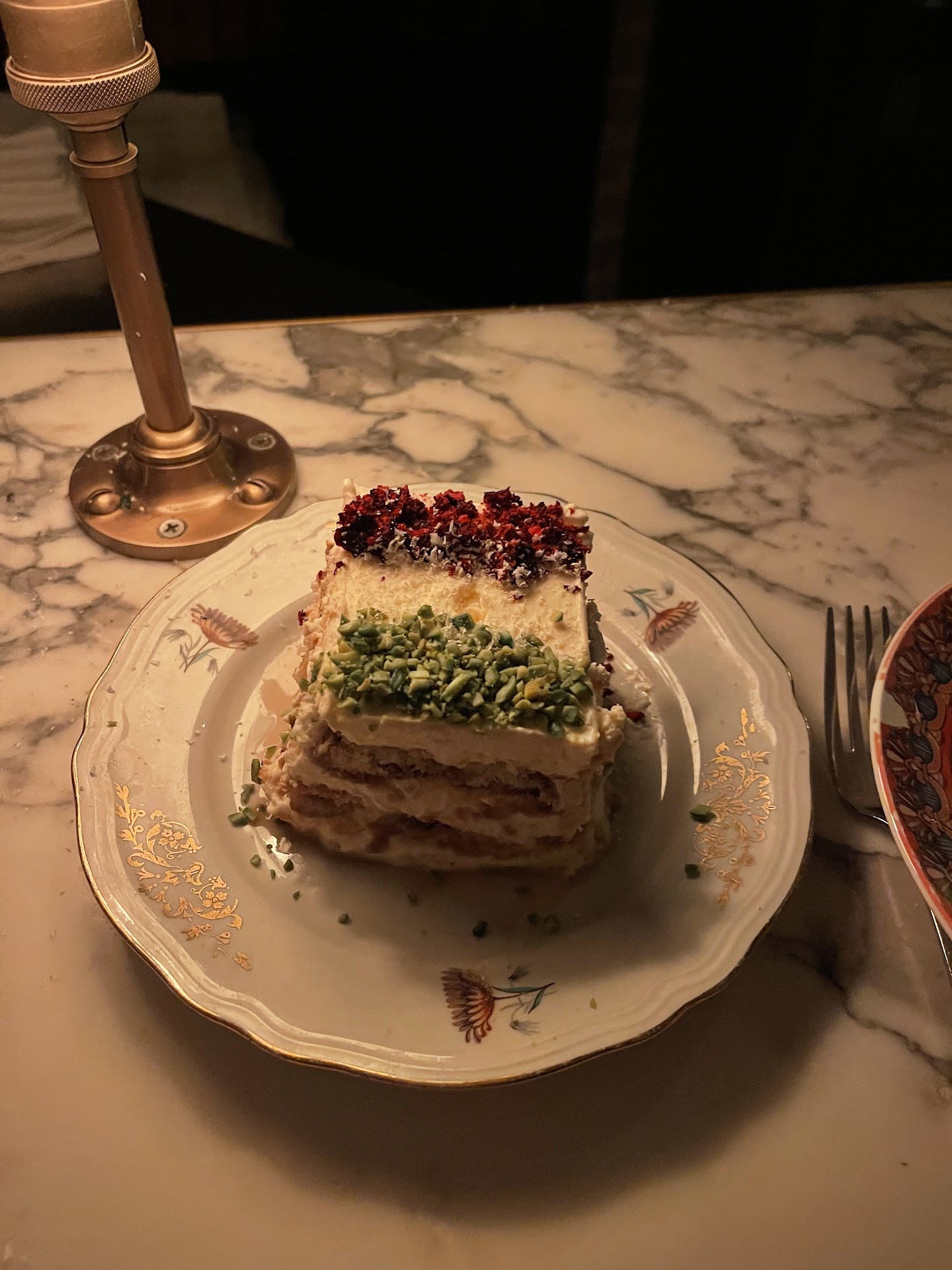 Layered dessert served on patterned china